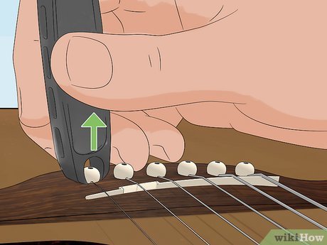 How to Change Guitar Strings (Acoustic or Electric Guitars)
