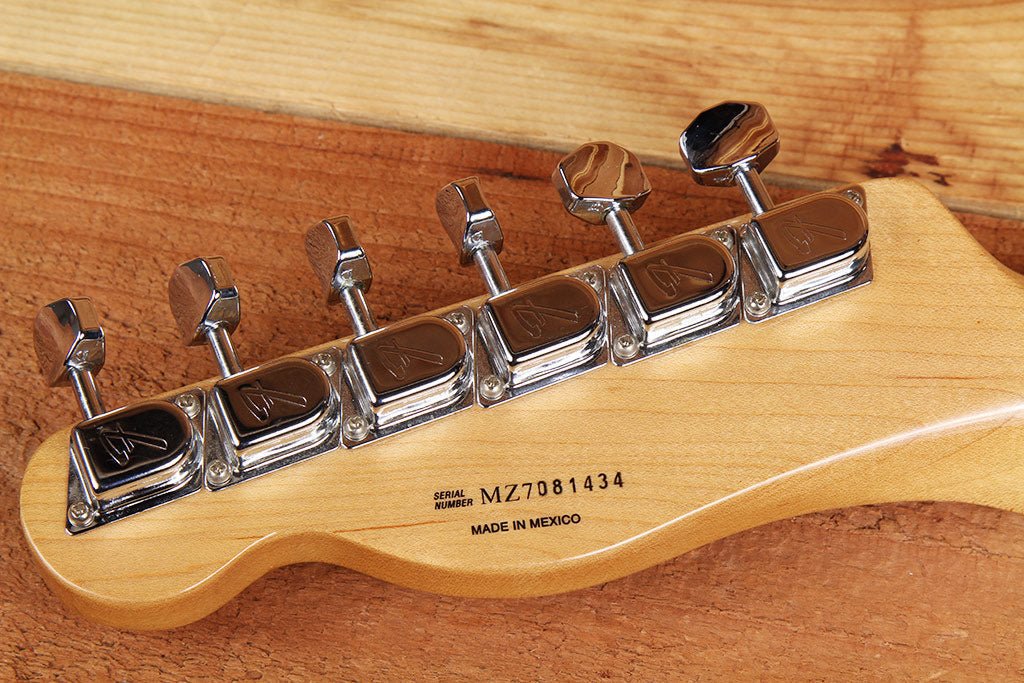 Photo of a guitar headback showing a serial number (Fender 1969 Tele Thinline) — visually represents serial-number identification and reference materials for dating/authenticating instruments.